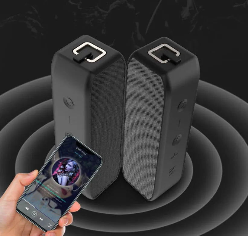 Black wireless waterproof Bluetooth speaker with button controls and USB port