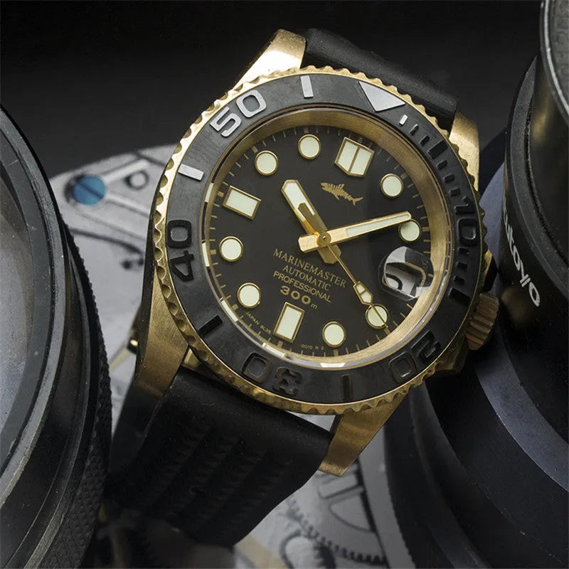 Men's vintage bronze automatic diving watch with gold dial and genuine leather strap on a wooden surface
