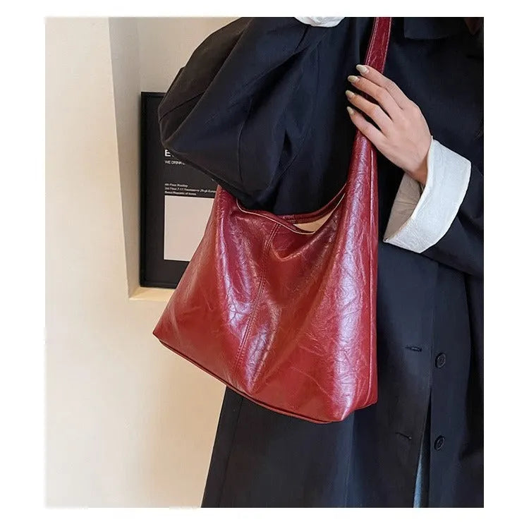 Women's large capacity PU shoulder tote bag in brown with sewing line detail and single strap