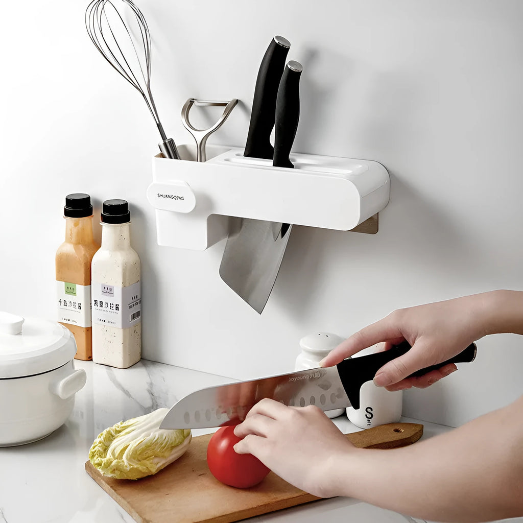 White plastic kitchen knife rack mounted on wall with dimensions 10.6 cm wide by 26 cm tall