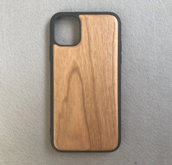 Wooden mobile phone case showing natural grain texture with iPhone 15 compatibility