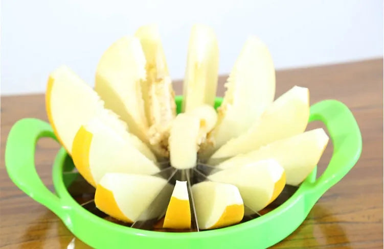 Green-handled watermelon slicer with 410 stainless steel blade on a kitchen counter