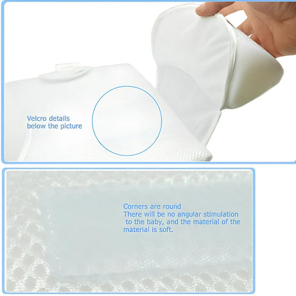 White baby sleep positioning pad with curved armrest and elevated head section