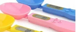 Digital spoon kitchen scale with LCD display showing weight measurement in grams