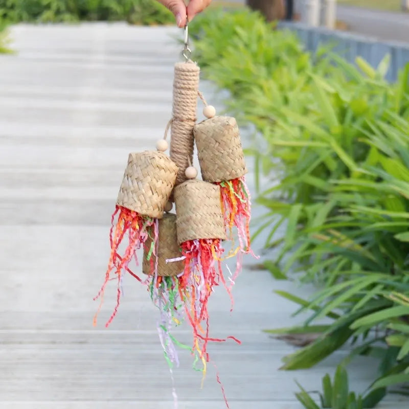 Colourful shredded paper parrot biting toy with wood beads and sisal rope, measuring 15 by 35 cm