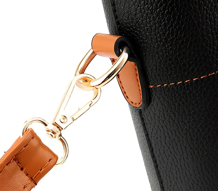 Women's black PU slung shoulder bag, 25cm height, adjustable strap for diagonal carry with phone and wallet inside