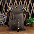Small black genuine leather men's fanny pack with a zip, worn around the waist.