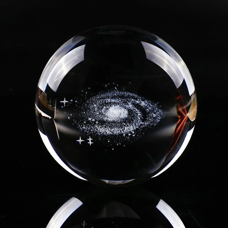 Mesmerizing Galaxy Crystal Ball made with premium K9 crystal, showcasing swirling celestial patterns and available in various sizes and base options.