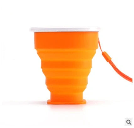 Collapsible stainless steel travel water cup showing expanded and compressed states