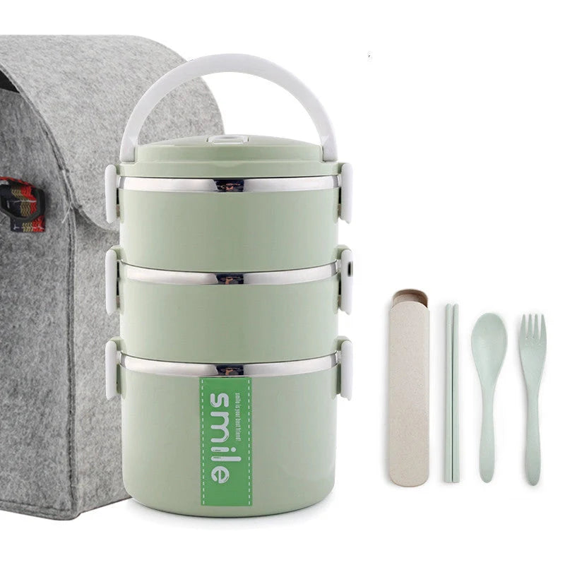 Stainless steel lunch box with built-in spoon, leak-proof design, in green, pink, and blue