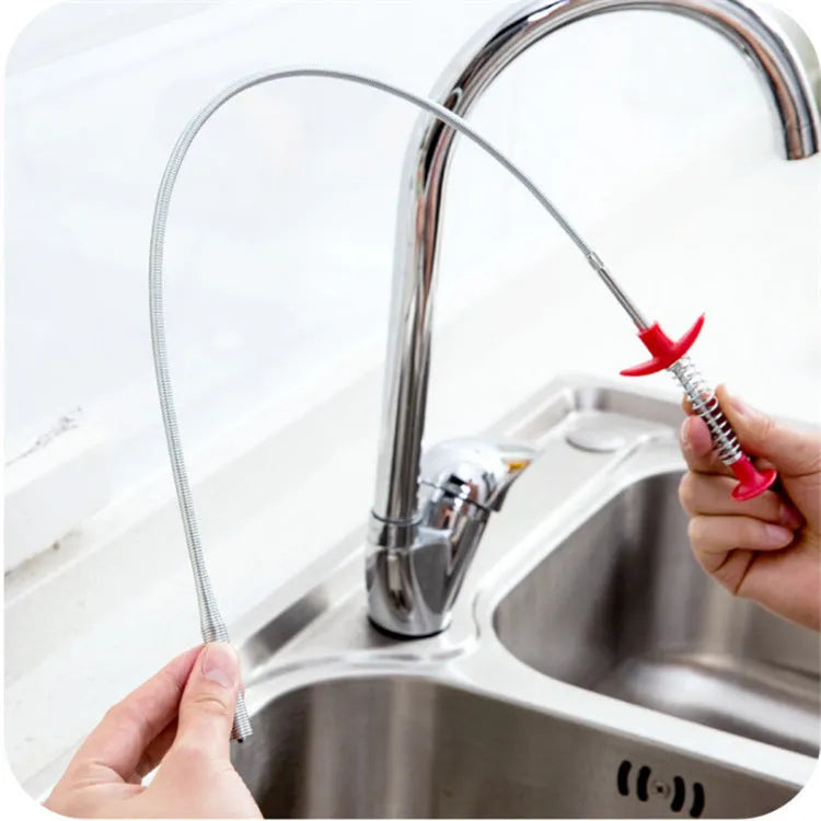 A black sewer dredge spring pipe cleaning tool for unblocking kitchen sink drains