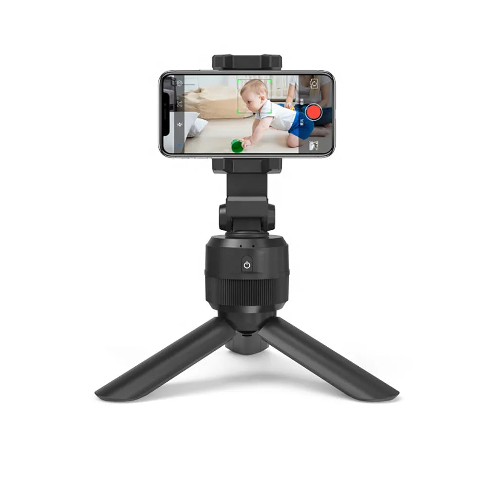 Black 360 degree rotating mobile phone holder on a desk, ABS construction with full rotation capability