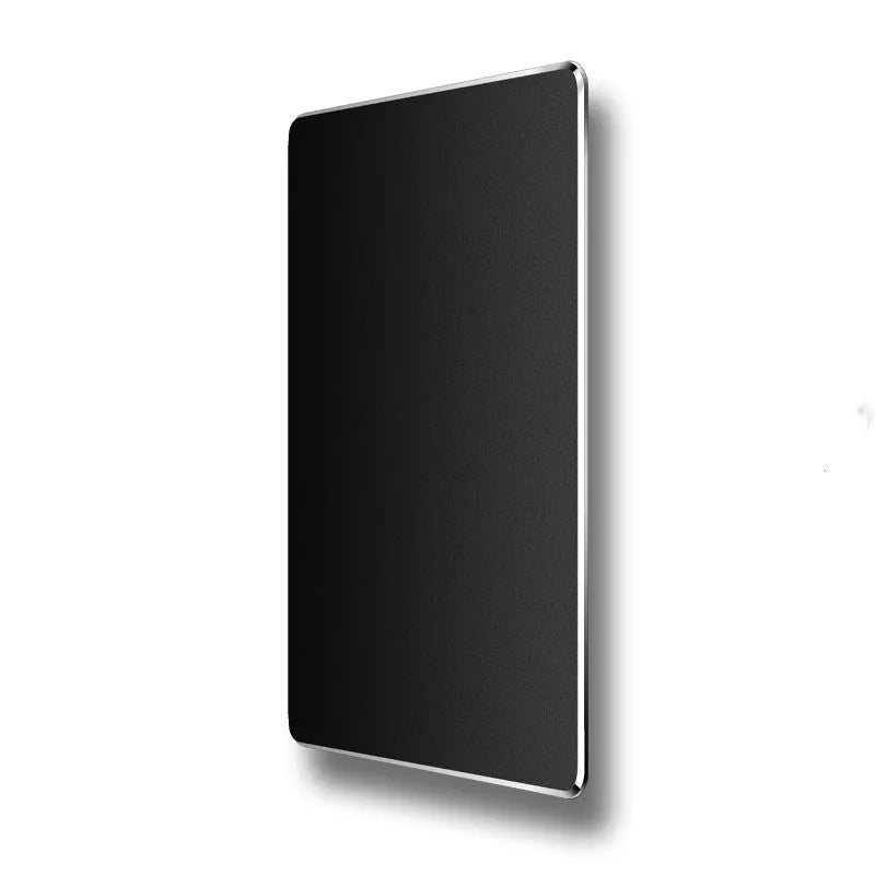 Double-sided aluminium mouse pad in black with non-slip base on a desk