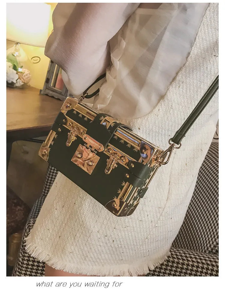 Hard PU women's shoulder bag with flap closure and cross body strap in black or green