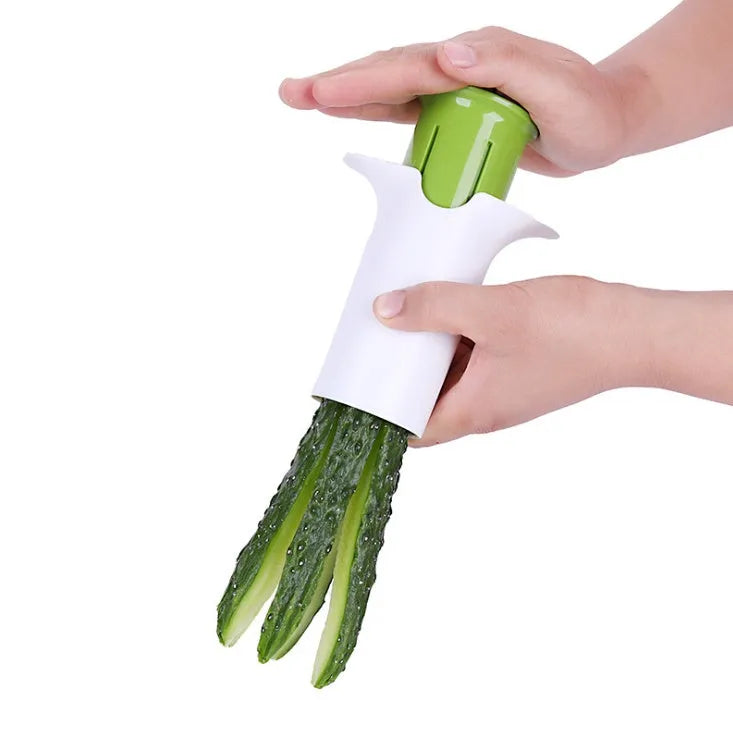 White kitchen vegetable slicer with six stainless steel blades for cucumbers and carrots.