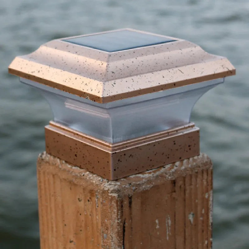 Outdoor solar column headlight with LED warm yellow light on a garden post
