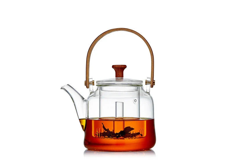 Japanese style glass bamboo handle teapot kettle on a wooden table
