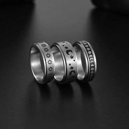 Titanium steel ring with rotating stars and moon design in various colors and sizes