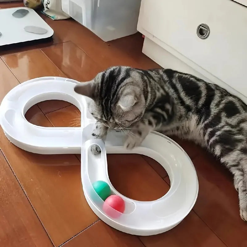 Blue interactive cat play track with turntable ball and four toy attachments on a white background.