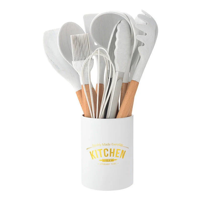 Elegant marbled silicone kitchenware set with wooden handle, perfect for cooking and baking.