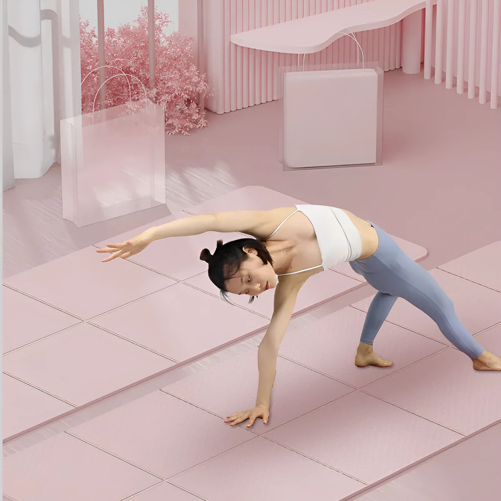 A folded purple TPE gymnastic mat showing its portable size next to an unfolded mat on a floor.