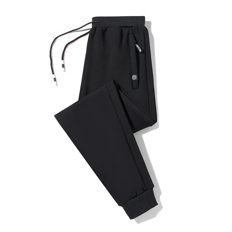 Plum Label men's large size casual sweatpants in flat black cotton knit with drawstring waist and skinny leg
