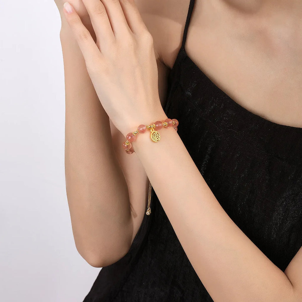 Strawberry quartz electroplated crystal bracelet with geometric fu charm