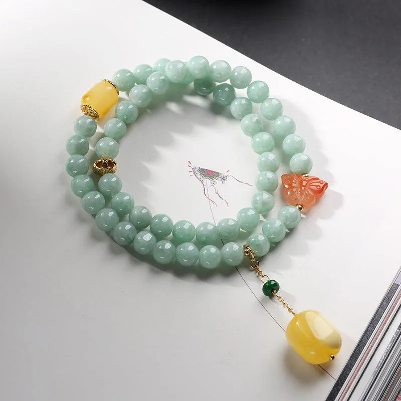 Double-layer women's bracelet with emerald jade round beads and beeswax barrel beads in geometric design