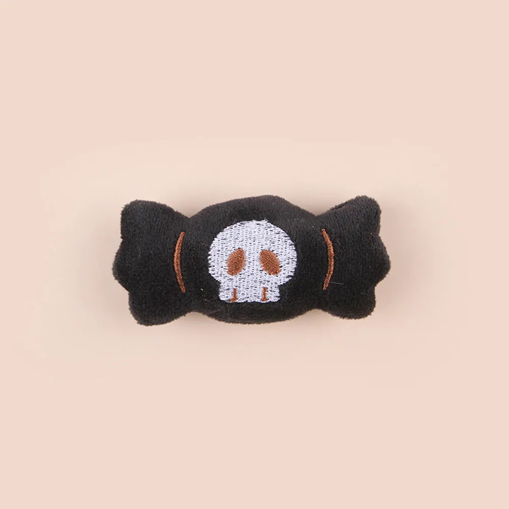 Small plush candy cat teaser wand on a stick in one of three colour designs: Eyes, Candy, or Skull.