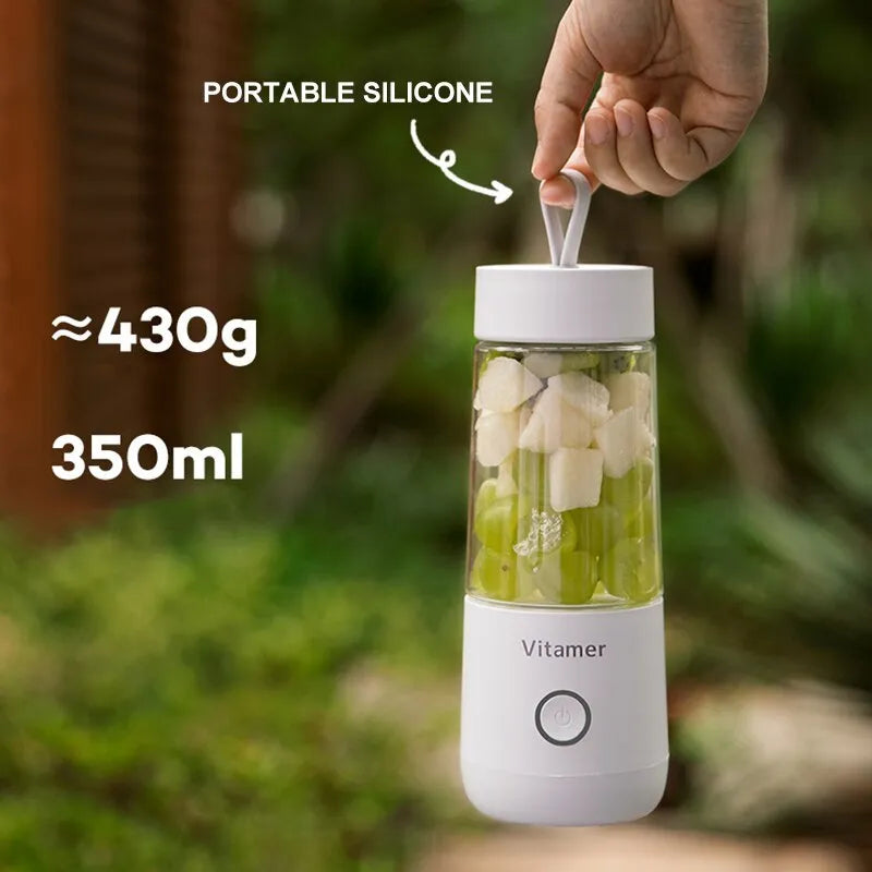 White portable USB rechargeable blender bottle with silicone handle and stainless steel blade.