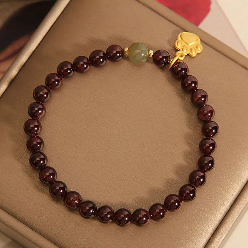 Women's adjustable crystal bracelet with Cat's Paw garnet colouration and original design