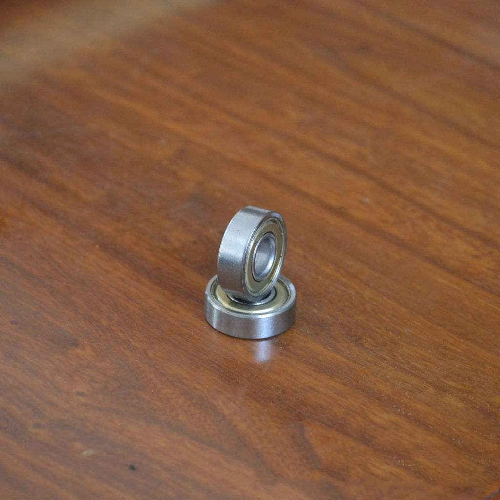 6000zz carbon steel miniature ball bearing showing 10mm inner diameter and 26mm outer diameter.