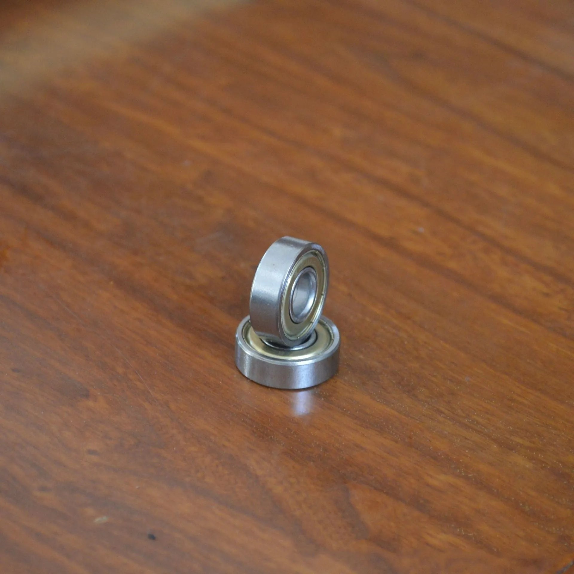 6000zz carbon steel miniature ball bearing showing 10mm inner diameter and 26mm outer diameter.