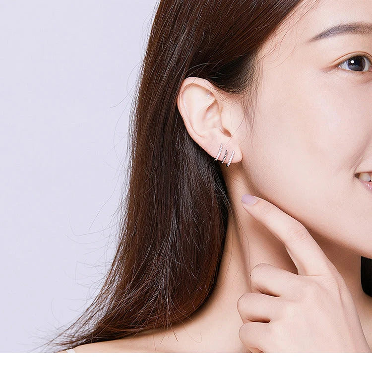 Three-layer sterling silver heart earrings with gem accents, handmade in Korean style