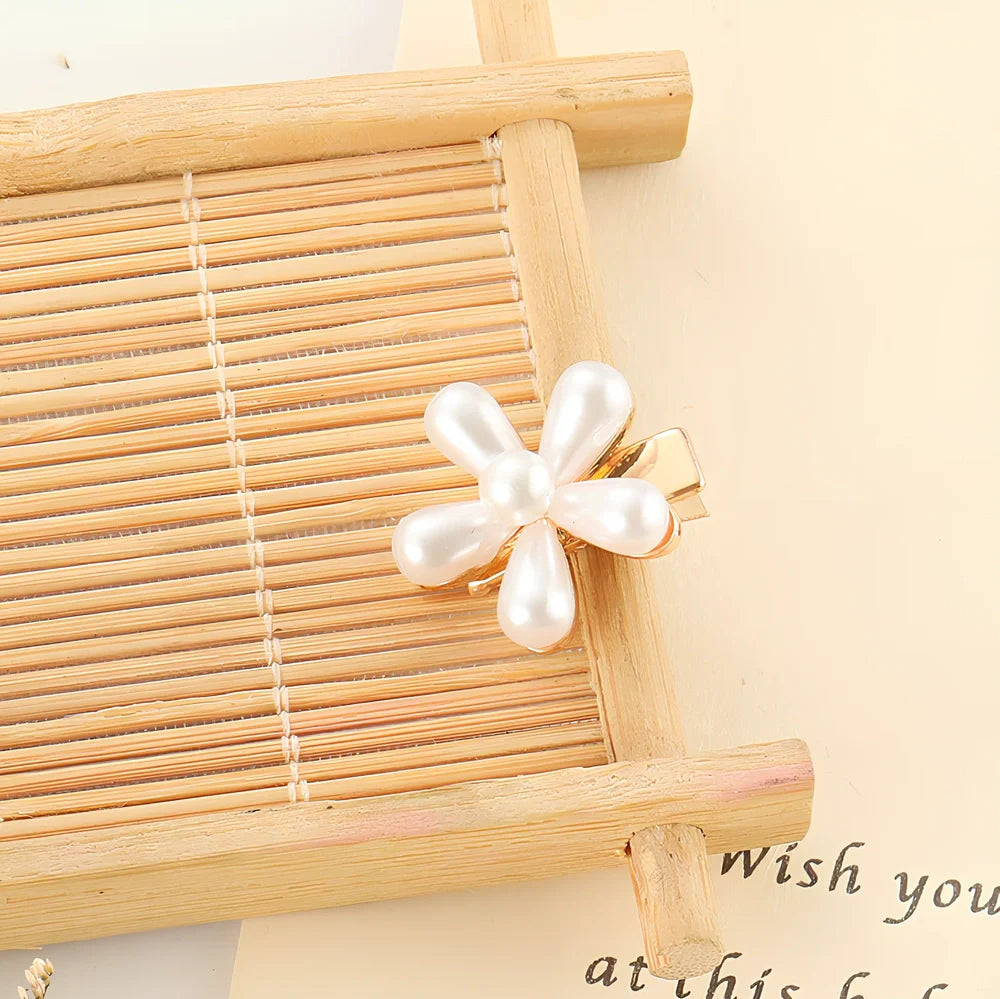 Slip-on pearl bow hair clip in alloy with flower at 2.4cm and pearls up to 7.2cm, secure grip design