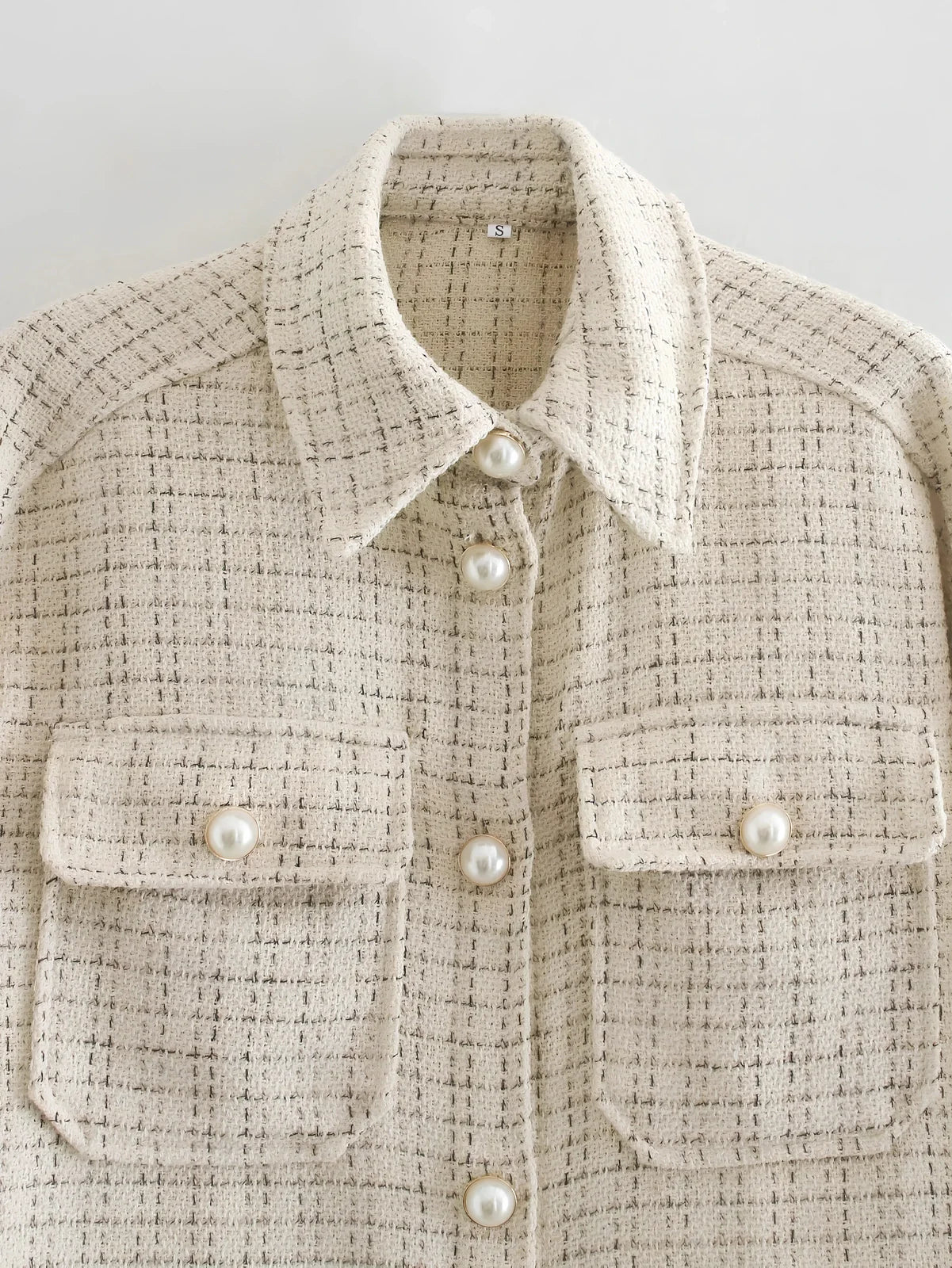 Women's beige plaid thick coat with pearl buttons, long sleeves, lapel collar, and side pockets in size M