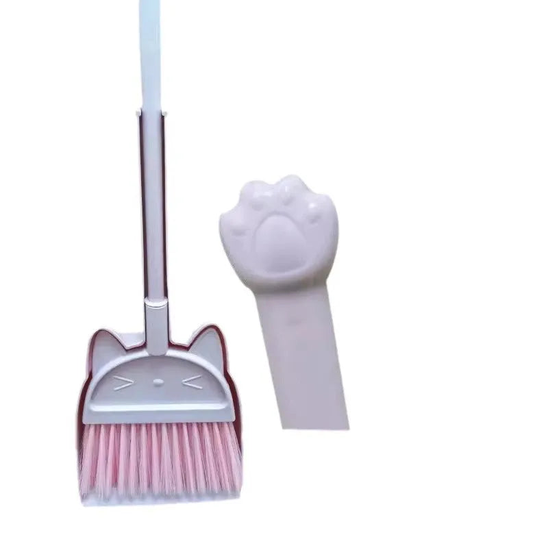 Purple plastic broom and dustpan set with rotating brush holder on a white background