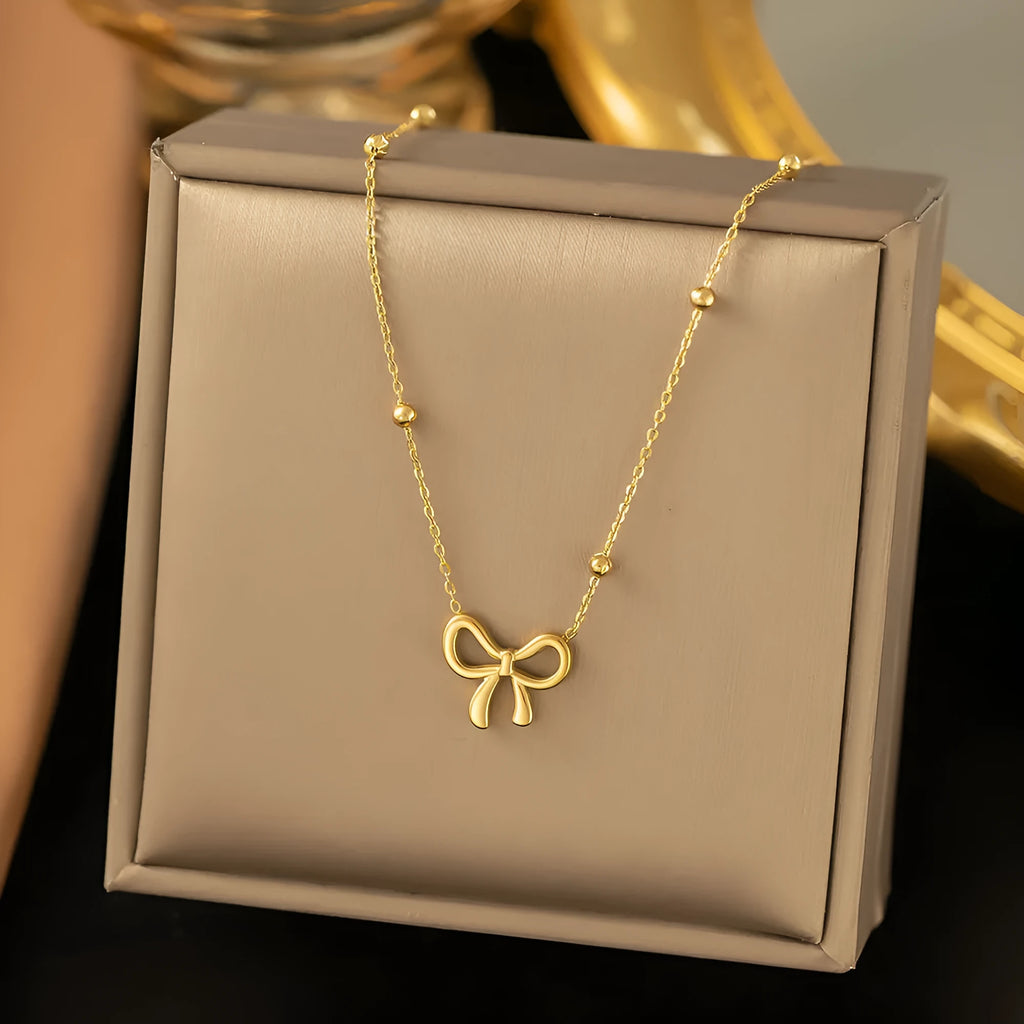 Gold bow necklace with titanium steel cross chain, adjustable length 41-50cm