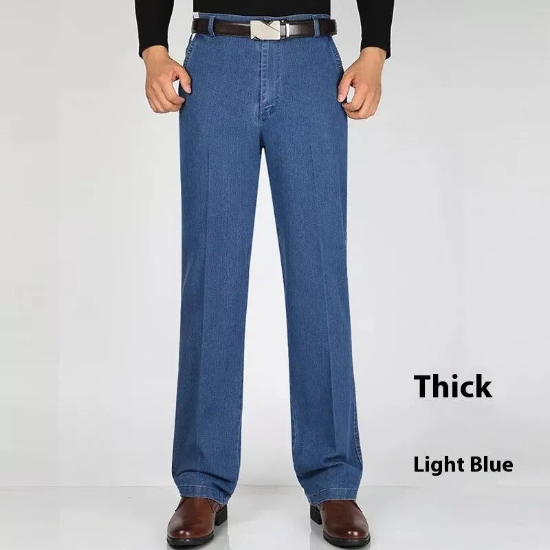 Men's high-waist loose-fit blue denim jeans on a hanger, showing the zip fly and relaxed leg cut.