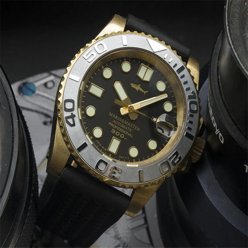 Men's vintage bronze automatic diving watch with gold dial and genuine leather strap on a wooden surface
