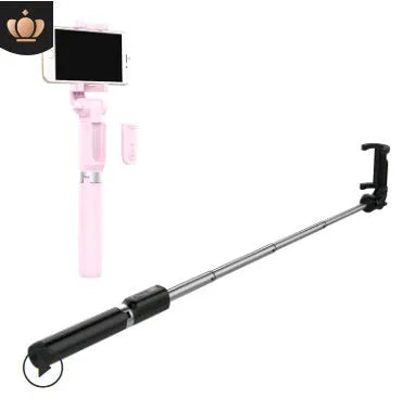 Aluminium telescopic Bluetooth selfie stick with tripod base and remote control next to a smartphone.