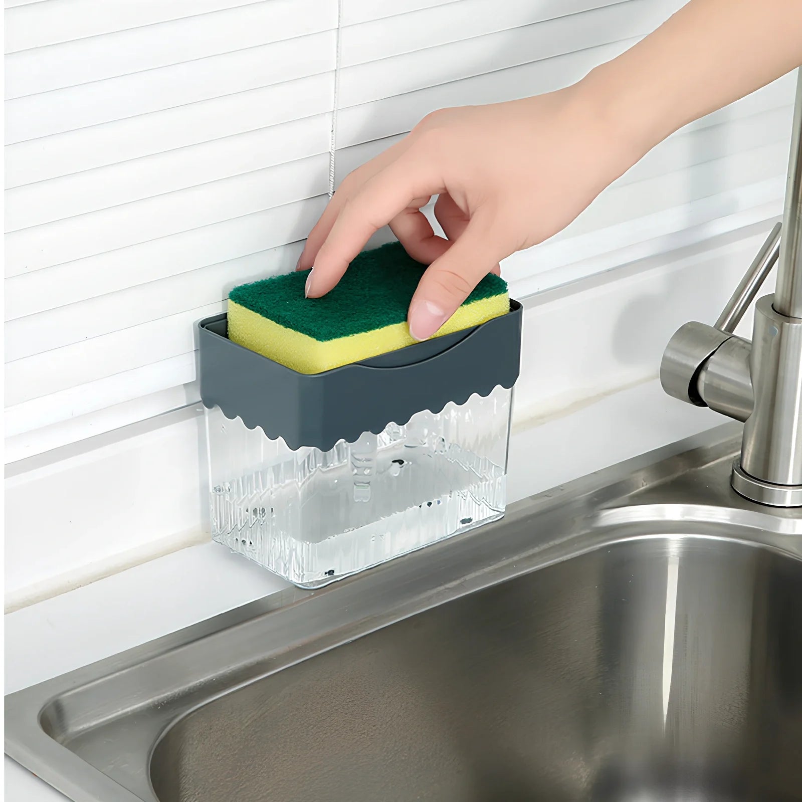 Dark blue 2-in-1 soap dispenser and sponge caddy unit on kitchen counter with measuring tape showing 13.5cm diameter
