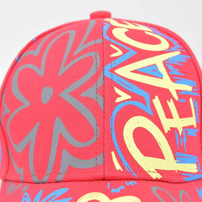 Cotton twill alphabet baseball cap in red, black, white, and pink options with adjustable strap