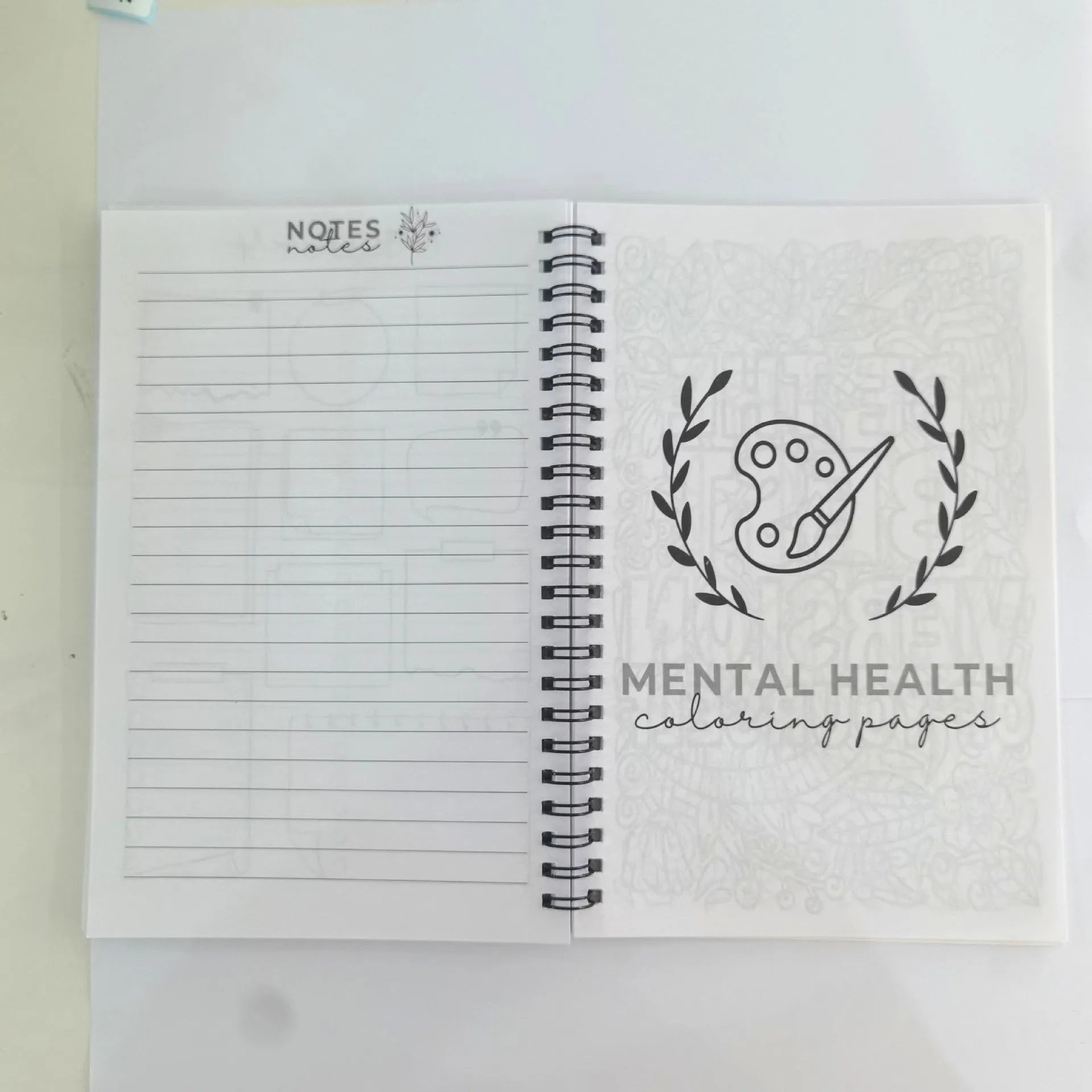 Pink brain mental health planning notepad with coil binding, A5 size, paper cover