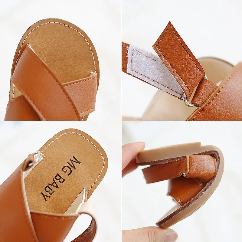 Children's cross strap Velcro sandals in brown, PU upper, beef tendon sole, side view on beach