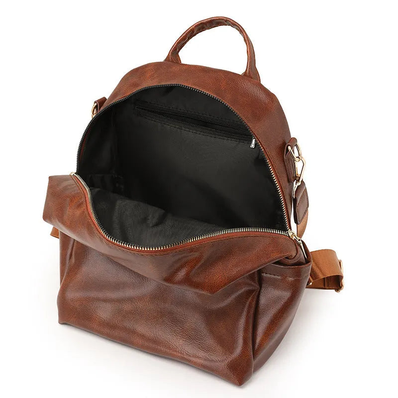 PU backpack with telescopic handle in black, square vertical shape, 24x15x31cm, sitting upright on floor