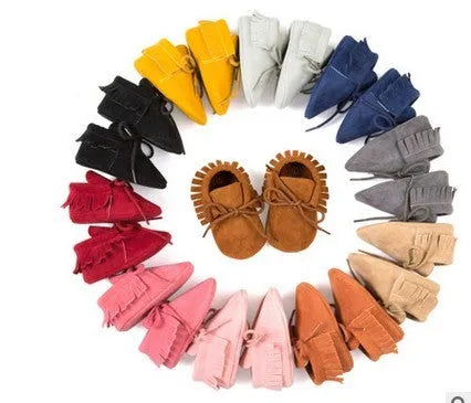 Pair of baby shoes with tassel and polychromatic sanding finish in a colourful pattern on soft sole