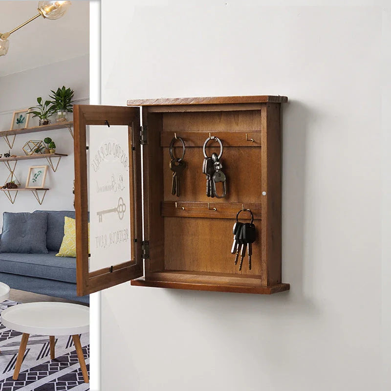 Rustic wooden key holder cabinet with six storage hooks, ideal for organizing keys and other small items in a Kiwi home