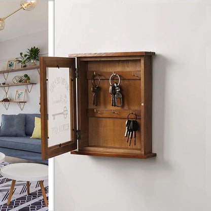 Rustic wooden key holder cabinet with six storage hooks, ideal for organizing keys and other small items in a Kiwi home