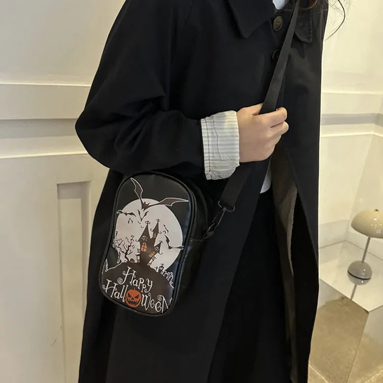 Halloween-themed crossbody phone bag with cartoon pumpkin, ghost, and bat print.